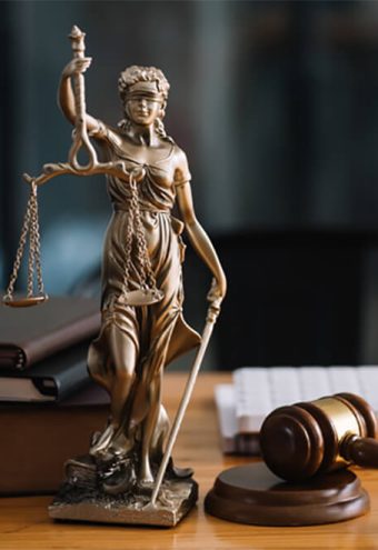 Statue of lady justice on desk of a judge or lawyer